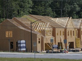 This Tuesday, May 16, 2017, photo shows new town homes under construction in Woodstock, Ga. The Standard & Poor's/Case-Shiller 20-city home price index for May is released, Tuesday, July 25, 2017. (AP Photo/John Bazemore)