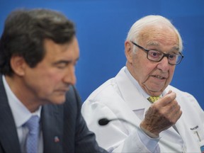 Jean Coutu Group Chairman Jean Coutu, right, and CEO Francois Coutu speak to the media following the company's annual general meeting in Varennes, Que., Tuesday, July 11, 2017. THE CANADIAN PRESS/Graham Hughes