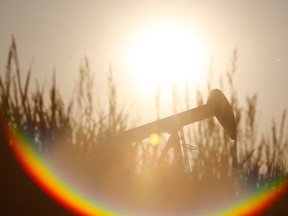 A pumpjack spins in a field near Grande Prairie, Alta. After two difficult years of low oil and gas prices, Grande Prairie’s economy is showing signs of improvement.