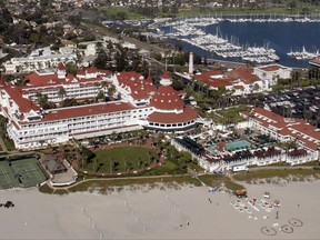 FILE - This Aug. 29, 2005 file photo shows an aerial view over the the historic Hotel del Coronado in Coronado, Calif. The landmark resort property that's housed guests along San Diego Bay since the 1880s, is now a Hilton hotel. (AP Photo/Susan Walsh,File)