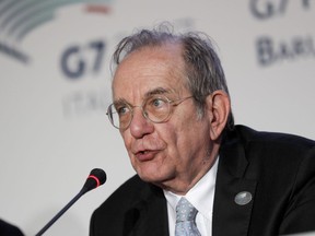 FILE - In Saturday, May 13, 2017 file photo, Italian Finance Minister Pier Carlo Padoan speaks during a press conference on the last day of a three-day summit of G7 of finance ministers, in Bari, Italy. Padoan said Tuesday, July 4, 2017, the plan to restructure the struggling bank Monte dei Paschi di Siena will provide "a credible future'' for the institution, while ensuring stability to the Italian banking sector. (AP Photo/Andrew Medichini, File)