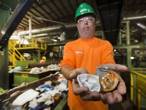 Canada Fibers Ltd. plant manager Brian Sneyd displays Keurig pods coffee at Canada’s busiest recycling facility, in Toronto, Thursday August 10, 2017. The pods are too light and small to be detected by sorting machines or the plant’s workers, so they head to landfill.