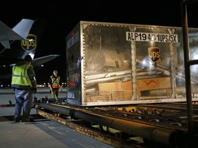 In this Nov. 20, 2015, picture, a UPS cargo plane is unloaded at the company's Worldport hub in Louisville, Ky. UPS Inc. reports earnings, Thursday, July 27, 2017. (AP Photo/Patrick Semansky)