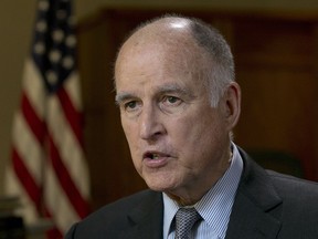 FILE - In this May 31, 2017 file photo, California Gov. Jerry Brown speaks during an interview in Sacramento, Calif. Brown announced yet another plan Wednesday, July 12, 2017, to keep the United States on track to reduce greenhouse gas emissions under the international Paris climate agreement. This time, he's teaming up with former New York City Mayor Michael Bloomberg to launch "America's Pledge," an initiative to compile all of the climate change-fighting commitments of states, cities, businesses and universities in one place where they can be easily tracked and shared.  (AP Photo/Rich Pedroncelli, File)