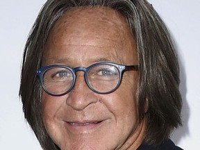 FILE - This March 20, 2016 file photo shows real estate developer Mohamed Hadid arriving at Daily Front Row's Fashion Los Angeles Awards. Hadid, the father of fashion models Bella and Gigi Hadid, has been fined and given community service for illegally building a gigantic mansion in Los Angeles' Bel Air district. The Los Angeles Times reports that Hadid was sentenced Thursday, July 20, 2017, to 200 hours of service, fined $3,000 and ordered pay the city more than $14,000 to cover building department costs. (Photo by Jordan Strauss/Invision/AP, File)