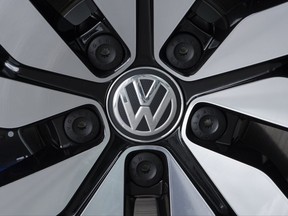 In this April 28, 2017 file photo an e-Golf electric car with the VW logo on a rim is pictured in the German car manufacturer Volkswagen Transparent Factory (Glaeserne Manufaktur) in Dresden, eastern Germany.