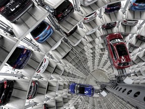 Volkswagen cars are lifted inside a delivery tower of the company in Wolfsburg, Germany.