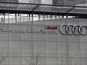 FILE - In this Wednesday, March 15, 2017 file photo, the four ring logo of German car producer Audi is photographed at the headquarters after the annual press conference in Ingolstadt, Germany. German automaker Audi says it will fit up to 850,000 diesel cars with new software to improve their emissions performance, following a similar move by rival Daimler as the auto industry tries to get ahead of public controversy over the technology. Audi, the luxury brand of the Volkswagen Group, announced the voluntary retrofitting program on Friday, July 21, 2017. (AP Photo/Matthias Schrader, file)