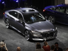 The 2018 Honda Accord is unveiled in Detroit, Friday, July 14, 2017. The 10th-generation Accord features the world's first 10-speed automatic transmission for a front-drive car and a new generation of Honda's two-motor hybrid technology. (AP Photo/Carlos Osorio)