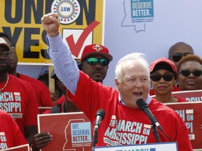 FILE-In this March 4, 2017, file photo, UAW president Dennis Williams calls for auto workers to demand their rights during a speech before thousands gathered at a pro-union rally near Nissan Motor Co.'s Canton, Miss., plant. The United Auto Workers filed Monday, July 10, 2017, an election petition with the National Labor Relations Board, to force a unionization election at the plant following years-long pressure campaign to build support. (AP Photo/Rogelio V. Solis, File)