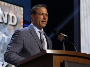 FILE - In this May 1, 2015, file photo, Chris Spielman speaks at the 2015 NFL Football Draft, in Chicago. One of Ohio State's most famous football stars sued the university Friday, July 14, 2017, over a marketing program he says used athletes' images without permission and robbed them of compensation. Linebacker Chris Spielman filed the antitrust lawsuit in federal court in Columbus on behalf of current and former Ohio State football players. The complaint targets Ohio State marketing programs and contracts that promote the university using likenesses of athletes, including a Honda-sponsored program of 64 banners hung around Ohio Stadium featuring photos of former players.(AP Photo/Charles Rex Arbogast, File)