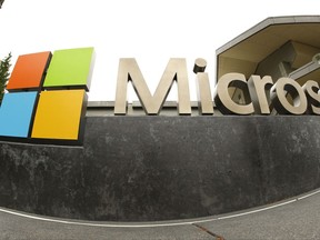 FILE - This July 3, 2014, file photo, shows the Microsoft Corp. logo outside the Microsoft Visitor Center in Redmond, Wash. Microsoft is announcing a project to bring broadband internet access to rural parts of the United States. Microsoft President Brad Smith said in a blog post that he plans to unveil details about the initiative at a Tuesday, July 11, 2017, event in Washington, D.C. (AP Photo/Ted S. Warren, File)