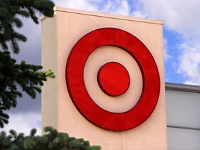 FILE - This May 3, 2017 file photo shows a Target logo on a store in Upper Saint Clair, Pa. Target is boosting its guidance for the second quarter after its campaign to revitalize the brand pushed sales higher and increased customer traffic. The Minneapolis discounter said Thursday, July 13, that it expects a modest increase in sales at existing stores, reversing a downward trend that has lingered for four consecutive quarters. (AP Photo/Gene J. Puskar, File)
