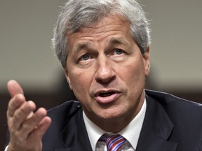 FILE - In this June 13, 2012, file photo, JPMorgan Chase CEO Jamie Dimon testifies before the Senate Banking Committee on Capitol Hill in Washington. During calls with reporters and Wall Street analysts on Friday, July 14, 2017, Dimon vented his irritation with politicians and the news media, arguing that the nation is spending too much time bickering instead of solving real issues. (AP Photo/J. Scott Applewhite, File)