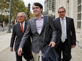 FILE - In this Thursday, July 27, 2017, file photo, former biotech CEO Martin Shkreli, center, leaves federal court with his attorney Benjamin Brafman, left, in New York. A jury began deliberations Monday, July 31, 2017, at  Shkreli's federal securities fraud trial. (AP Photo/Julie Jacobson, File)
