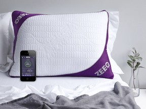 This photo provided by REM-Fit shows the Zeeq pillow, which monitors snoring and can gently vibrate to nudge someone into a different sleep position. The pillow can also play your favorite music, audio books and more without disturbing anyone next to you. A number of companies are adding more technology into their products, hoping to lure customers craving a better night's sleep. (Jo Henderson/REM-Fit via AP)