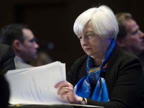 FILE - In this Thursday, March 23, 2017, file photo, Federal Reserve Chair Janet Yellen looks at documents while waiting to speak at the Federal Reserve System Community Development Research Conference in Washington. Beginning Wednesday, July 12, 2017, Yellen speaks to Congress about monetary policy and the state of the economy. (AP Photo/Cliff Owen, File)