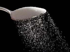 FILE - This Monday, Sept. 12, 2016, file photo, shows granulated sugar in Philadelphia. U.S. President Donald Trump recently praised a new sugar deal with Mexico. But U.S. food makers say it will result in Americans paying even more for sugar than they already are. (AP Photo/Matt Rourke, File)