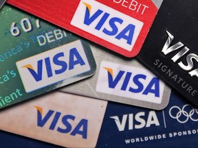 FILE - This Wednesday, June 4, 2014, file photo shows a selection of Visa cards in Boston. Visa Inc. reports earnings, Thursday, July 20, 2017. (AP Photo/Charles Krupa, File)