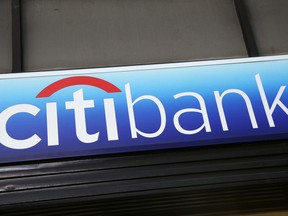 FILE - In this Jan. 15, 2015, file photo, a Citibank sign hangs above a branch office in New York. On Friday, July 14, 2017, Citigroup Inc. reports financial results. (AP Photo/Mark Lennihan, File)