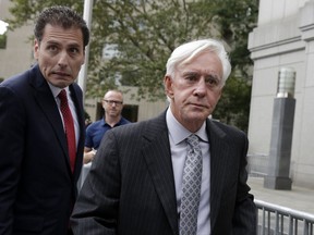 Las Vegas gambler William "Billy" Walters, right, accompanied by one of his attorneys, leaves Manhattan federal court, in New York, Thursday, July 27, 2017. Walters, linked to golfer Phil Mickelson, was sentenced to five years in prison for his conviction on insider trading charges.(AP Photo/Richard Drew)