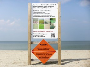 FILE – This Sept. 1, 2015, file photo shows a warning sign for algal toxins on a beach in Maumee Bay State Park, located on Lake Erie in Oregon, Ohio. Researchers are working on creating an early warning system that can spot when algae begins showing up on hundreds of lakes across the U.S., using real-time data from satellites that already monitor harmful algae hotspots on Lake Erie in Ohio and on the Chesapeake Bay along the East Coast. (AP Photo/Haraz N. Ghanbari, File)