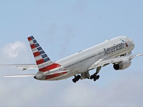 was removed from an Atlanta to Chicago flight on Wednesday, July 5, 2017. Video shows passengers yelling at a fellow passenger who followed a flight attendant while letting her dog run through the cabin without a leash.(AP Photo/Alan Diaz, File)