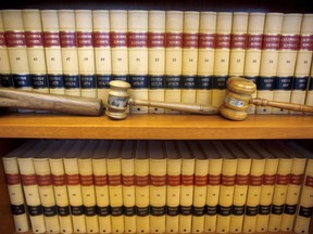 FILE--In this July 14, 2010, file photo, gavels and law books are shown in the office of California Supreme Court Chief Justice Ronald George at his office in San Francisco, Calif. The State Bar of California on Monday, July 31, 2017, proposed lowering the minimum score on the most recent licensing exam for attorneys amid an alarming decline in people passing the test considered one of the toughest in the U.S. (AP Photo/Jeff Chiu, file)