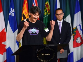 Jerry Natanine, community leader and former mayor of Clyde River, speaks during a press conference on Parliament Hill following a ruling at the Supreme Court of Canada in Ottawa on Wednesday, July 26, 2017. Clyde River's legal counsel Nader Hasan looks on. THE CANADIAN PRESS/Sean Kilpatrick
