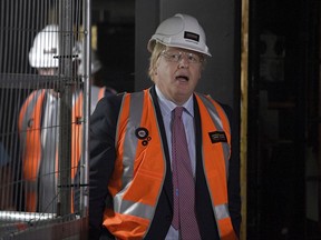 British Foreign Secretary Boris Johnson tours construction work underway at the Sydney Opera House, in Sydney, Wednesday, July 26, 2017. Johnson is in Sydney to attend AUKMIN, the annual meeting of the countries' foreign and defense ministers. (Dan Himbrechts/Pool Photo via AP)