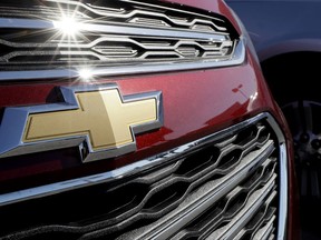 In this April 25, 2017, photo, a Chevrolet truck sits in a General Motors dealer's lot in Nashville, Tenn. General Motors Co. reports financial results, Tuesday, July 25, 2017. (AP Photo/Mark Humphrey)