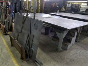 In this photo taken Feb. 12, 2015, cut panels of steel used to make blades to build fans for industrial ventilation systems are stored on the production floor in Harmony, Pa. President Donald Trump pledged during the campaign to help U.S. factory workers by slapping tariffs on foreign steel, but his long-awaited decision on the issue is running behind schedule. (AP Photo/Keith Srakocic)