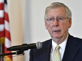 FILE - In this June 30, 2017 file photo, Senate Majority Leader Mitch McConnell, of Kentucky, speaks in Elizabethtown, Ky. The number of people without health insurance in the U.S. has grown by nearly 2 million this year, according to a major new survey. It may foreshadow deeper coverage losses if Republican legislation passes Congress and estimates of its impact prove accurate. (AP Photo/Timothy D. Easley, File)