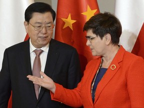 Chairman of the Standing Committee of China's National People's Congress Zhang Dejiang, left, looks at Polish Prime Minister Beata Szydlo prior to talks in Warsaw, Poland, Thursday, July 13, 2017. (AP Photo/Alik Keplicz)