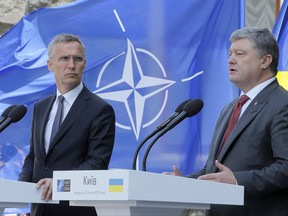 Ukrainian President, Petro Poroshenko, right, and NATO Secretary General Jens Stoltenberg attend a joint press conference in Kiev, Ukraine, Monday, July. 10, 2017.  Speaking Monday with NATO Secretary General Jens Stoltenberg in Kiev, Poroshenko said Ukraine would not be applying for a NATO membership "immediately" but would instead "build a genuine program of reforms" to meet NATO requirements for membership in the future. (AP Photo/Efrem Lukatsky)