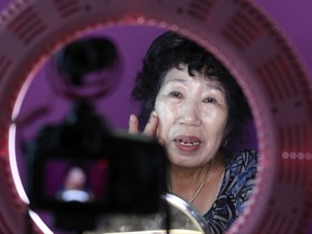 South Korea's YouTube star, Park Makrye, 70, gives a demonstration of make-up tutorials for her YouTube channel during an interview at her home in Yongin, South Korea.  Park's videos are all about showing off her wrinkles and her elderly life in the raw.
