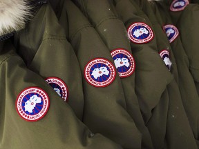 Jackets hang at the factory of Canada Goose Inc. in Toronto on Thursday, November 28, 2013.