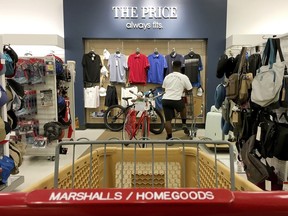 In this Monday, May 15, 2017, photo, a shopper looks at shirts at a Marshalls & Home Goods retail store, part of the TJX Companies brand, in Phoenix. On Friday, Aug. 11, 2017, the Labor Department reports on U.S. consumer prices for July. (AP Photo/Ross D. Franklin)