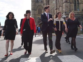 Status of Women Minister Maryam Monsef, left to right, Minister of International Development and La Francophonie Marie-Claude Bibeau, Prime Minister Justin Trudeau, Sophie Gregoire Trudeau and Women Deliver President and CEO Katja Iversen arrive at an event in Ottawa on Tuesday, June 13, 2017. The Liberal government is thinking about using its massive purchasing power to support women in business. THE CANADIAN PRESS/Sean Kilpatrick