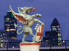A dragon stands guard at one of the boundaries of The City financial district in London with Canary Wharf visible in the background.