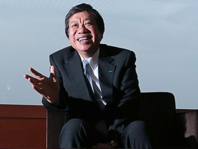 Yasuyoshi Karasawa, president and chief executive officer of MS&AD Insurance Group Holdings Inc., gestures as he speaks during an interview in Tokyo, Japan, on Tuesday, June 17, 2014.