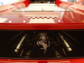 A Ferrari F50 model on display at H.R. Owen Ferrari Atelier in London, Wednesday, Aug. 2, 2017. Ferrari, which spun off last year from its mass-market parent Fiat Chrysler, said Wednesday net profit for the three months through June was 136 million euros ($161 million), from 97 million euros in 2016. (AP Photo/Caroline Spiezio)