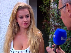 In this image made from video taken on Sunday, Aug. 6, 2017, model Chloe Ayling speaks with the media outside of her house in Surrey, England. The lawyer for British model Chloe Ayling says police are holding a suspect in her kidnapping. The 20-year-old says she was lured to Italy with the promise of a photo shoot, then drugged and kidnapped by a man who advertised her as a sex slave on the criminal "dark web." Ayling says her captor released her at the British consulate in Milan. Her lawyer acknowledges that aspects of the case seem bizarre. (RAI via AP)