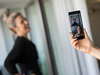 Workers demonstrate the front and rear cameras on the Nokia 8 smartphone, designed by HMD Global Oy, ahead of its official unveiling in London