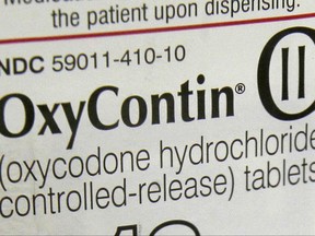 FILE - This Feb. 19, 2013, file photo, shows a portion of the label for OxyContin pills in Montpelier, Vt. On Thursday, Aug. 31, 2017, safety advocates and state health officials filed a petition calling on the U.S. Food and Drug Administration to ban high-dose opioid painkillers to prevent accidental overdose deaths among patients and people who abuse drugs. The petition singles out the OxyContin 80 milligram tablet, which is taken twice daily, adding up to 240 morphine-equivalent milligrams. It seeks a ban on other high-dose opioid tablets and under-the-tongue films. (AP Photo/Toby Talbot, File)