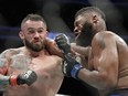 File- This July 8, 2017, file photo shows Daniel Omielanczuk, left, hitting Curtis Blaydes in a heavyweight mixed martial arts bout at UFC 213, in Las Vegas. The UFC is set to use a technology platform that could enhance the way fans watch fights. The world's leading mixed martial arts promotion has reached a partnership with Heed. The joint venture between WME-IMG and AGT International wants to change the way fans connect with sports at home or at a live event through sensor-measured data.(AP Photo/John Locher, File)