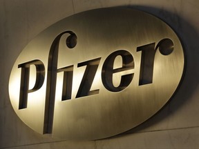 FILE - This Monday, Nov. 23, 2015, file photo, shows the Pfizer logo on display at the company's world headquarters in New York. Pfizer Inc. (PFE) on Tuesday, Aug. 1, 2017, reported second-quarter profit of $3.07 billion. (AP Photo/Mark Lennihan, File)