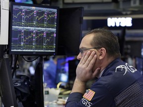 FILE - In this Wednesday, April 26, 2017, file photo, specialist Anthony Matesic works on the floor of the New York Stock Exchange. The year's run to a record for the stock market has been one of the least eventful in decades. But don't get lulled: Many professional investors expect a bumpier ride ahead. (AP Photo/Richard Drew, File)