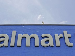 FILE - This Thursday, June 1, 2017, file photo shows a Walmart store in Hialeah Gardens, Fla. On Monday, Aug. 21, 2017, Walmart announced it is expanding its grocery delivery service with ride-hailing service Uber to two more markets: Dallas and Orlando, Fla. The world's largest retailer had launched a pilot grocery service with Uber in 2016 in Phoenix and then Tampa, Fla., earlier in 2017. (AP Photo/Alan Diaz, File)