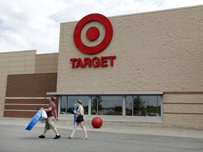 In this Monday, June 27, 2016, photo, customers walk with their purchases from a Target store, in Methuen, Mass. Target Corp. reports earnings, Wednesday, Aug. 16, 2017. (AP Photo/Elise Amendola)